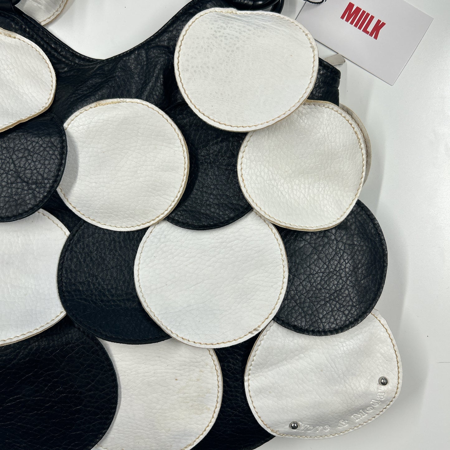 black and white faux leather disc beaded shoulder bag