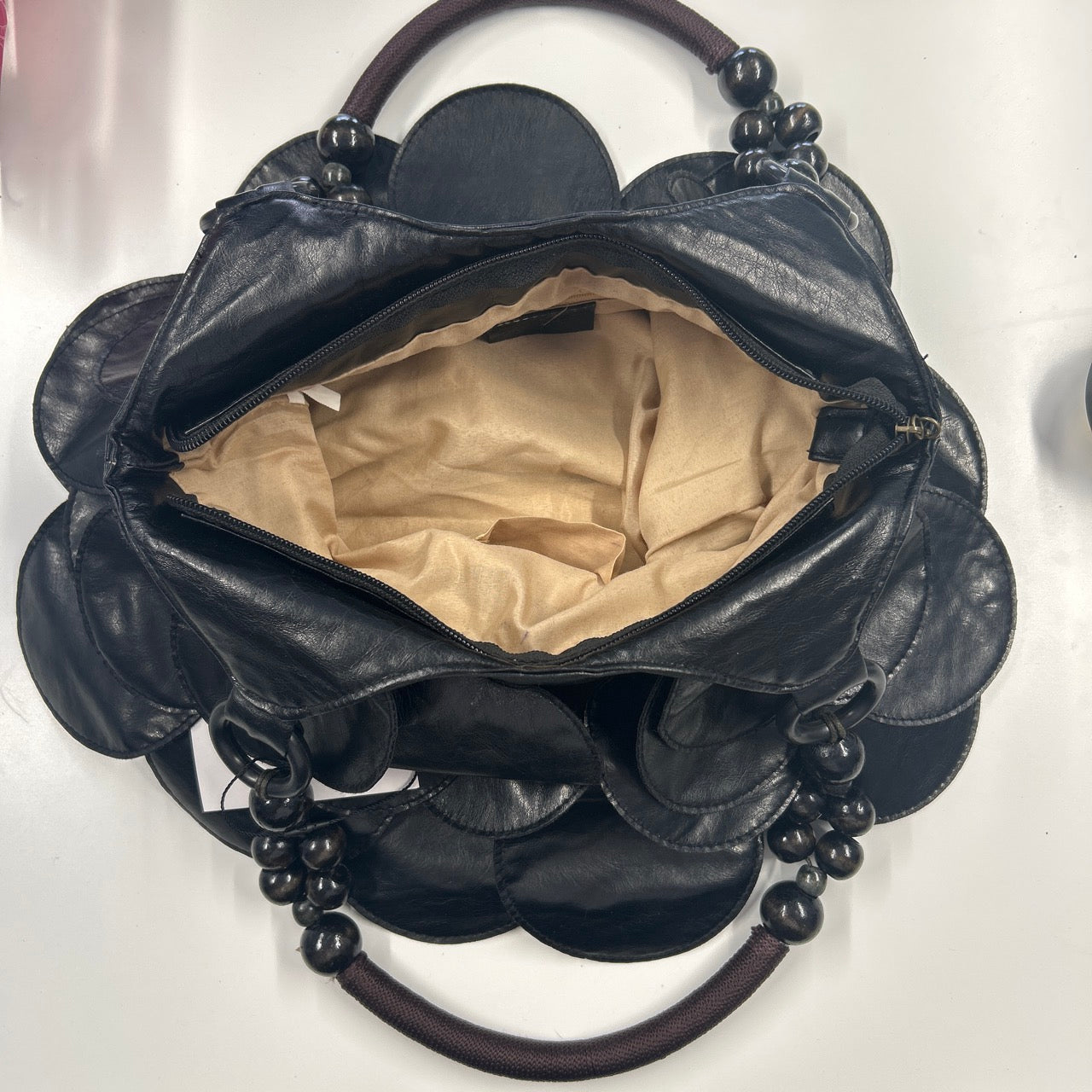 black faux leather disc beaded shoulder bag