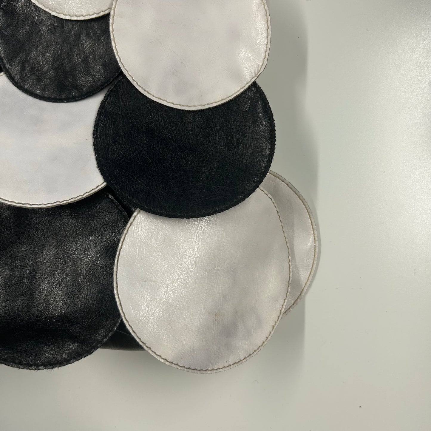 black and white faux leather disc beaded shoulder bag