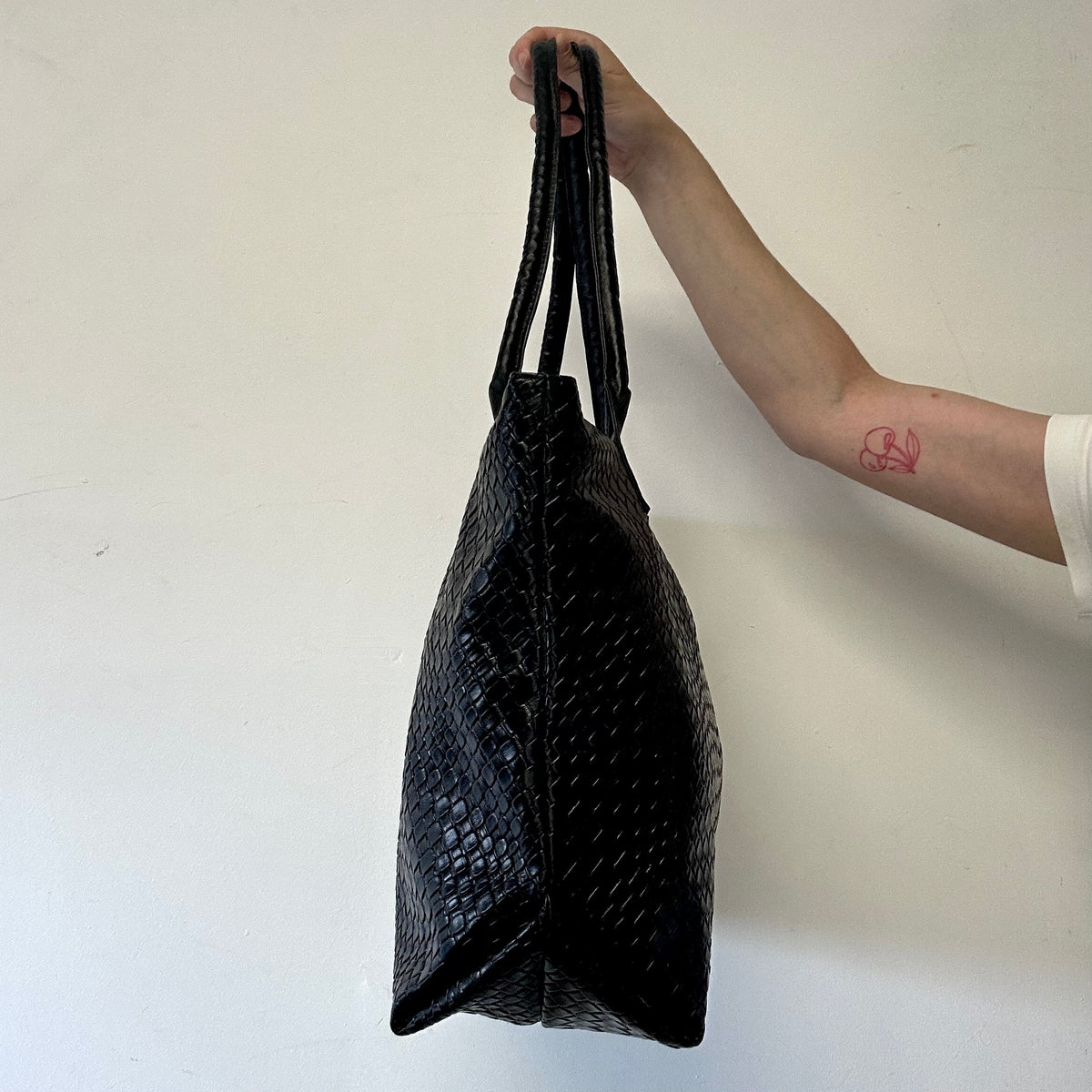 black faux leather woven effect shoulder bag