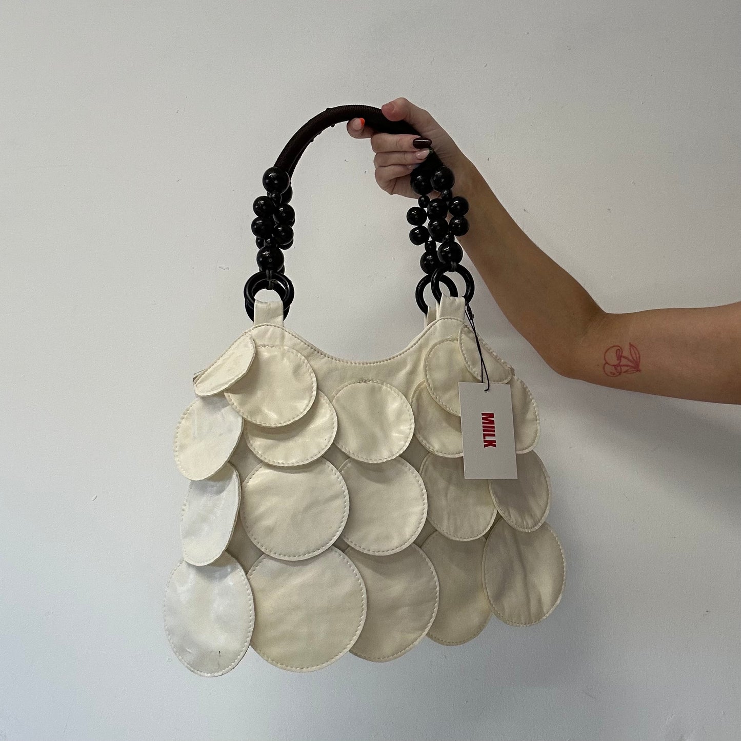 white faux leather disc beaded shoulder bag