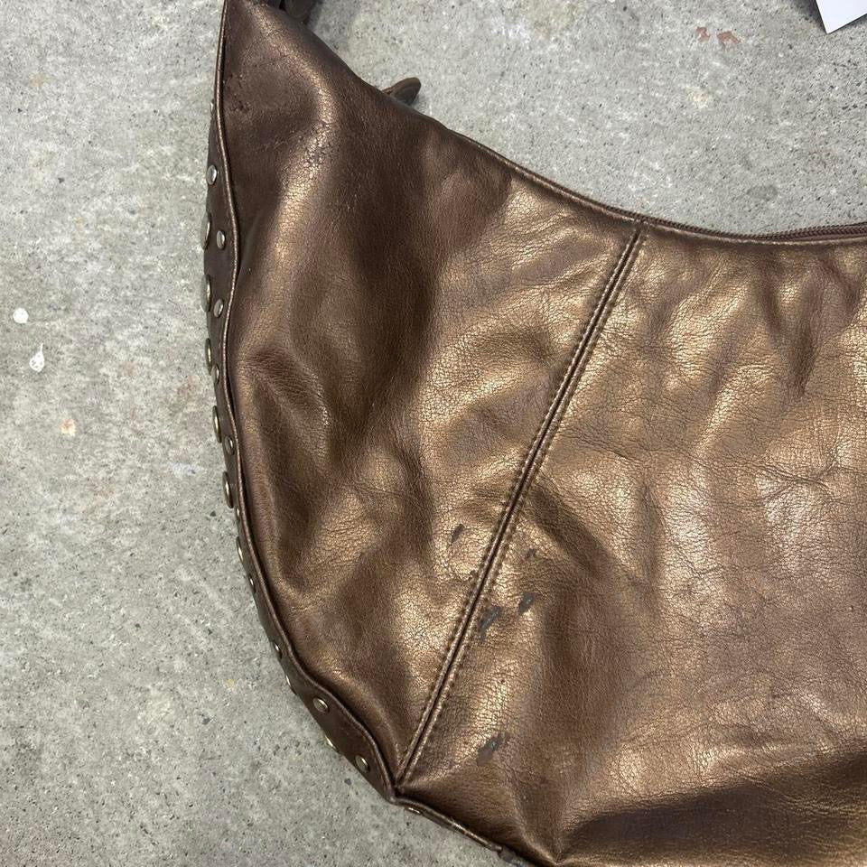 brown studded crescent faux leather shoulder bag