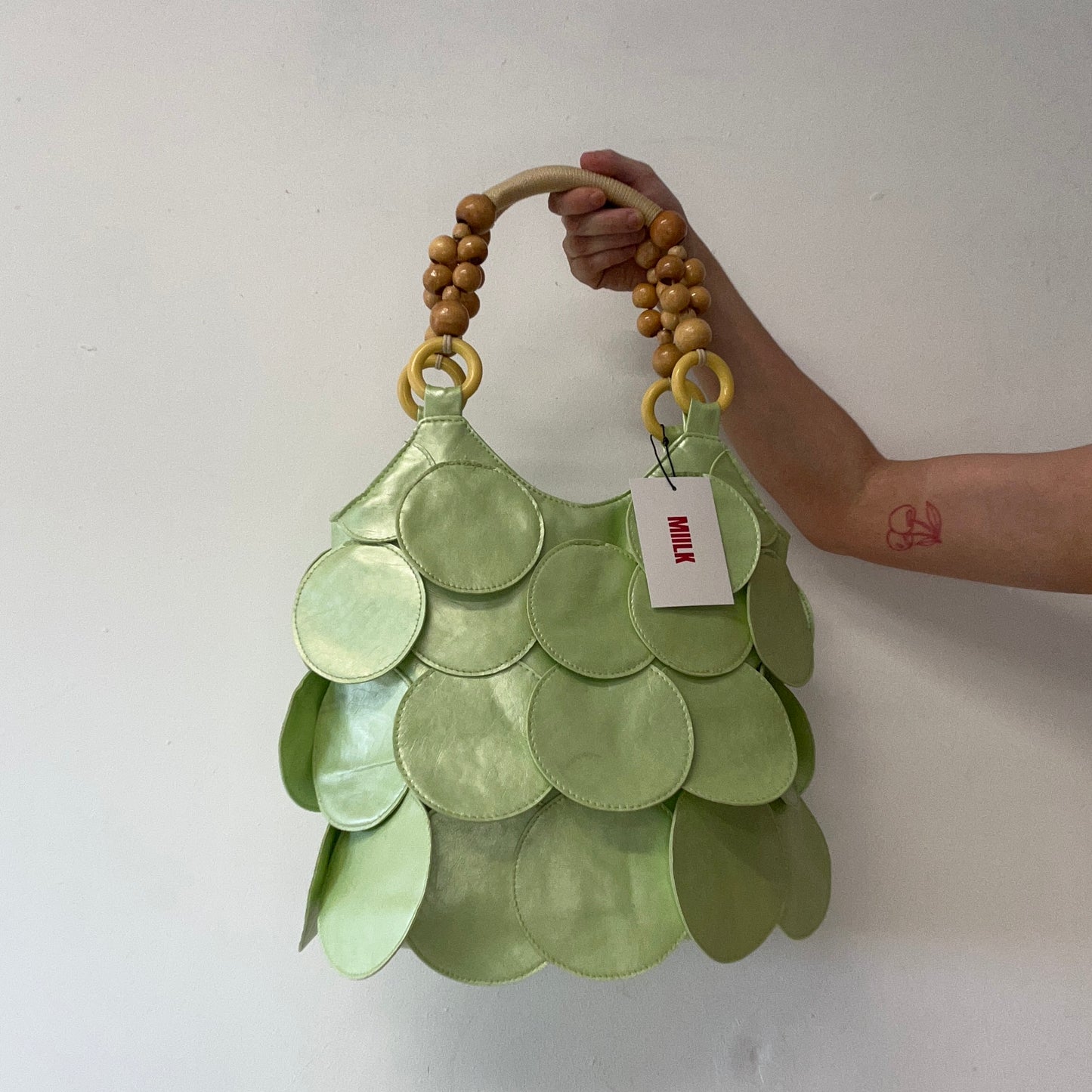 mint green faux leather disc beaded shoulder bag