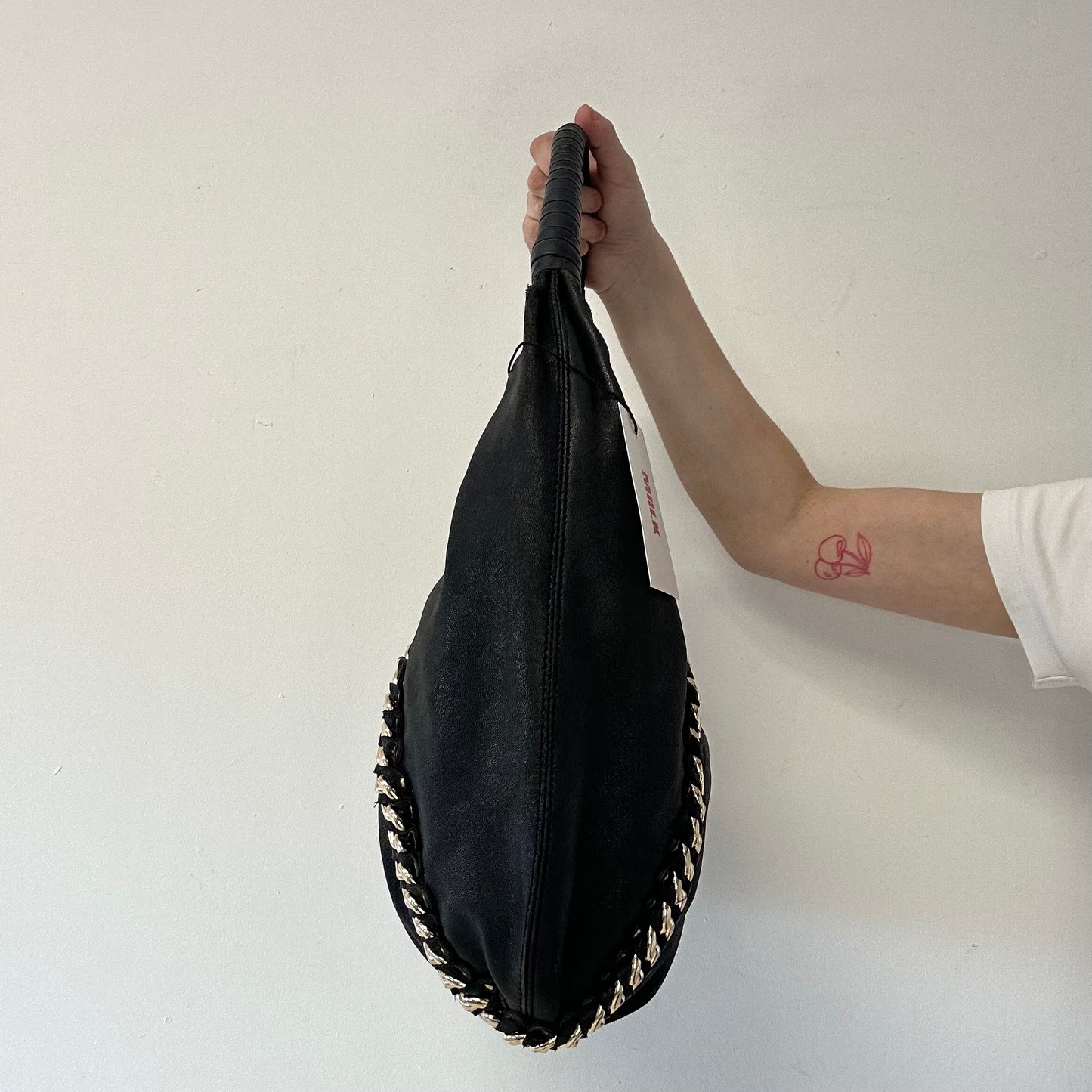 black genuine leather studded half crescent shoulder bag