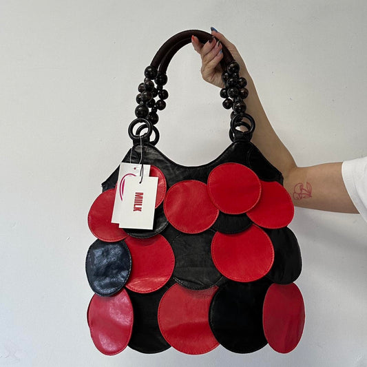black and red faux leather disc shoulder bag