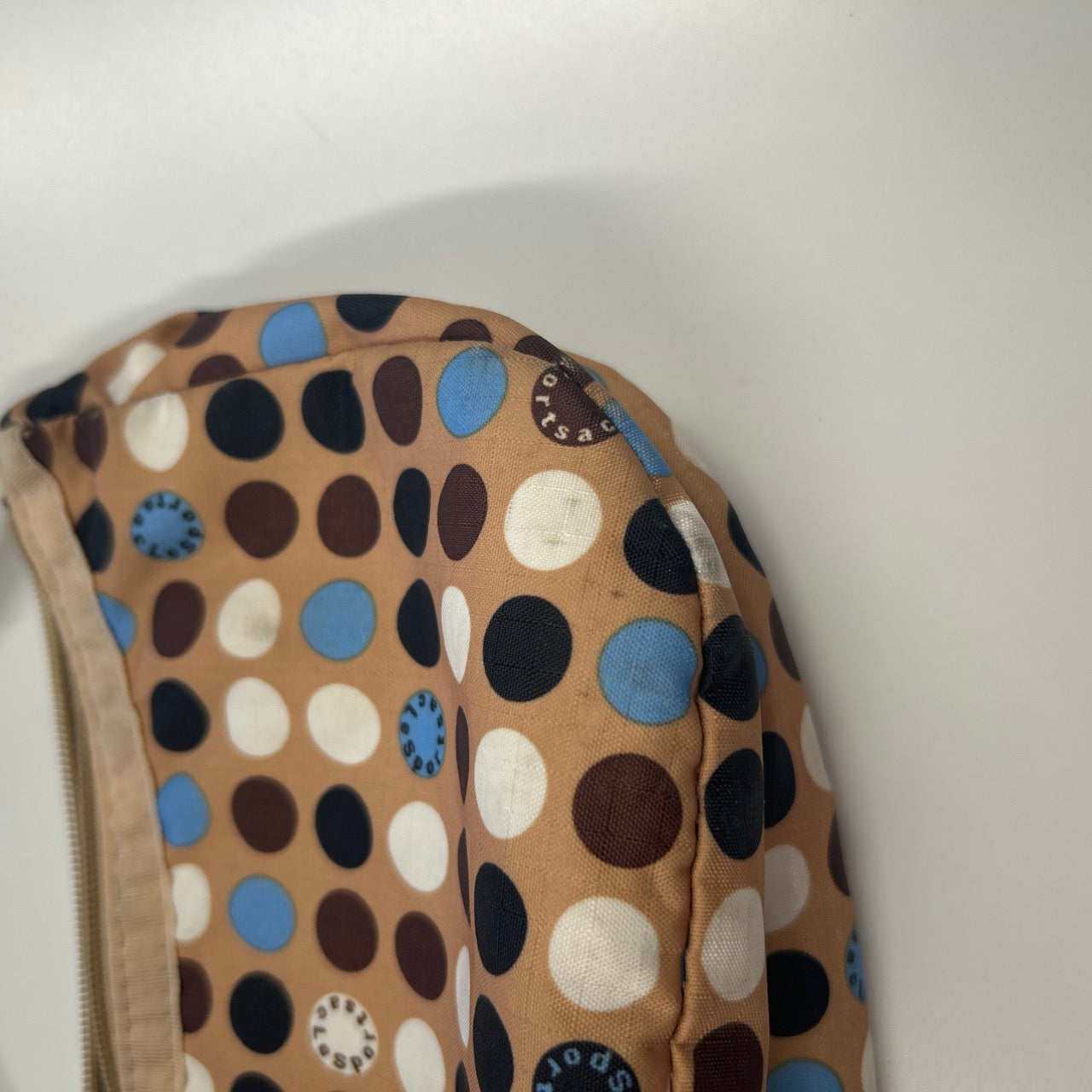 tanned blue polka dot canvas mini shoulder bag