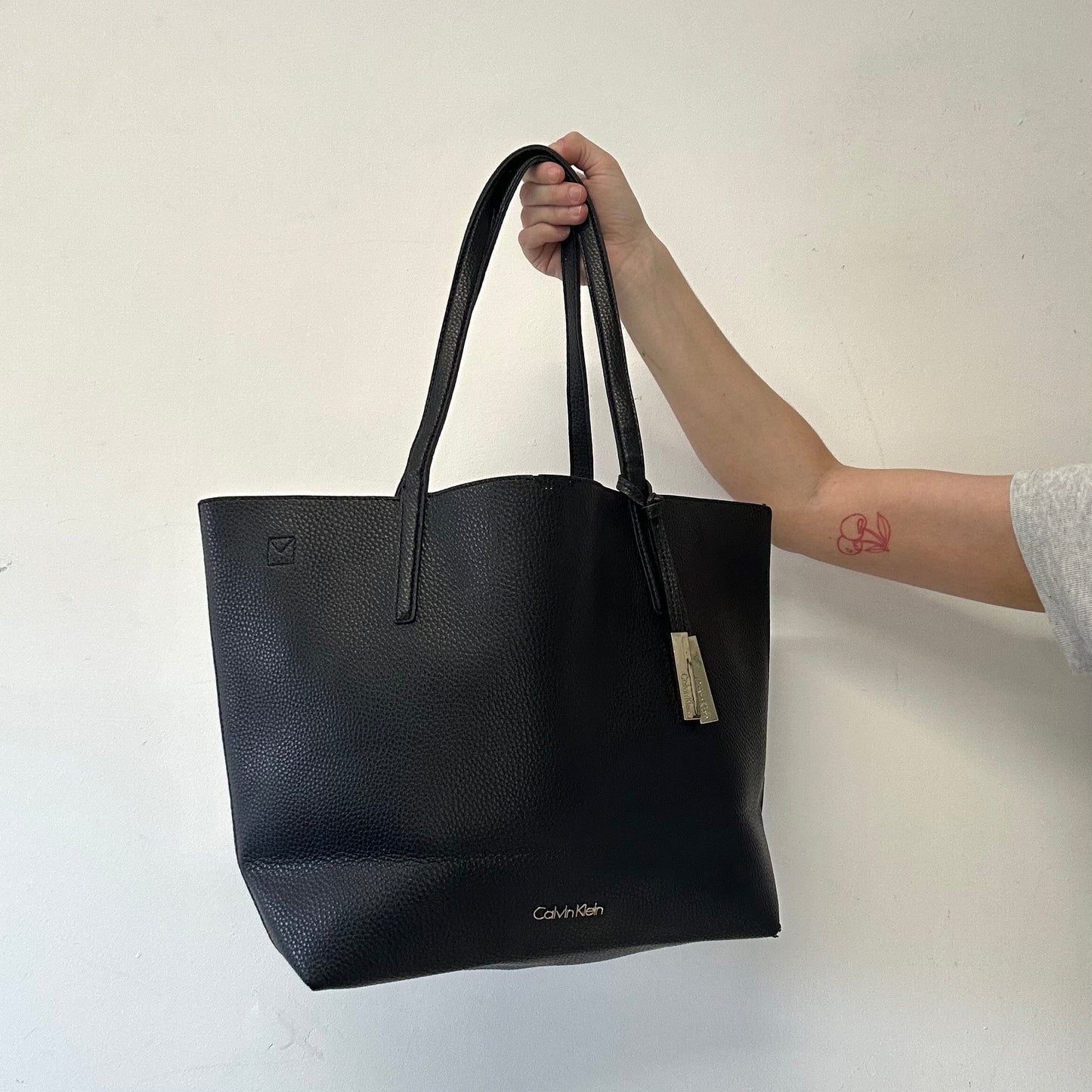 black Calvin Klein faux leather shoulder bag