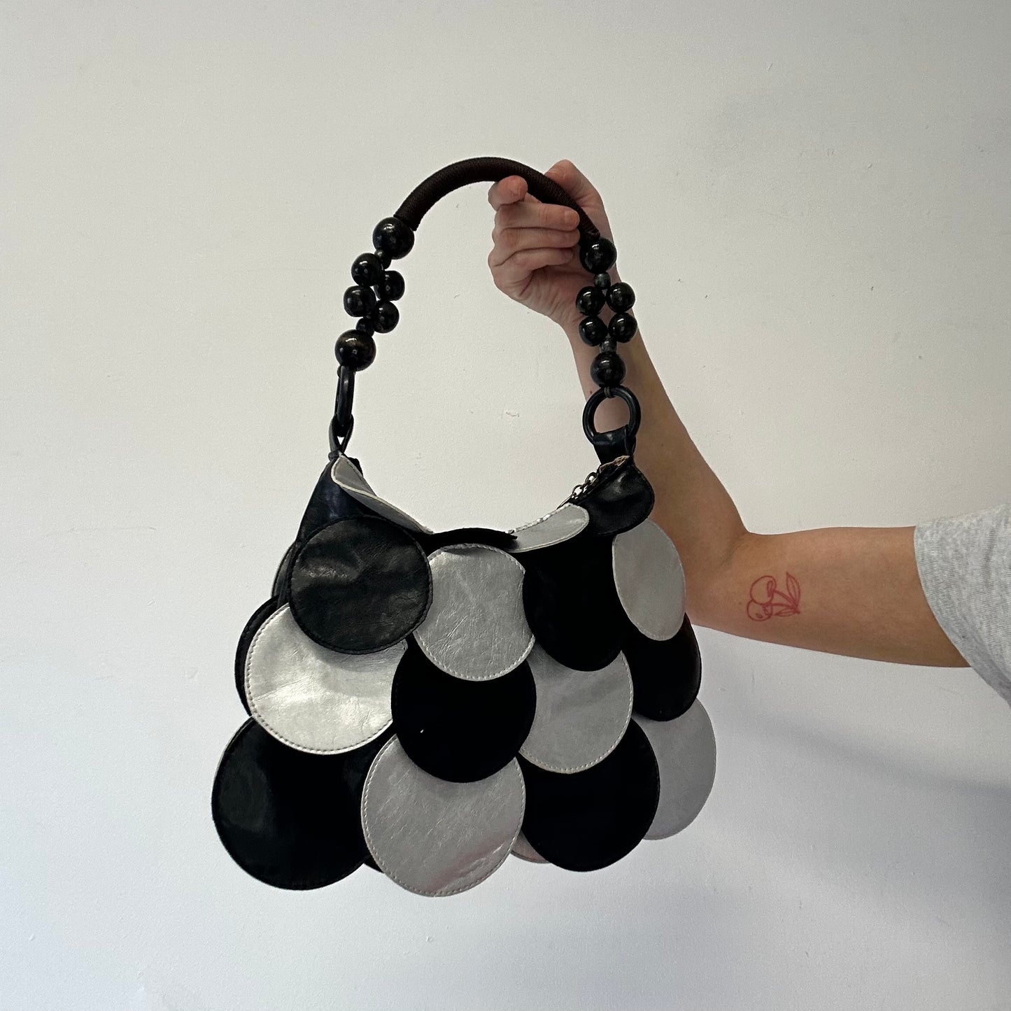 black and silver faux leather disc beaded shoulder bag very