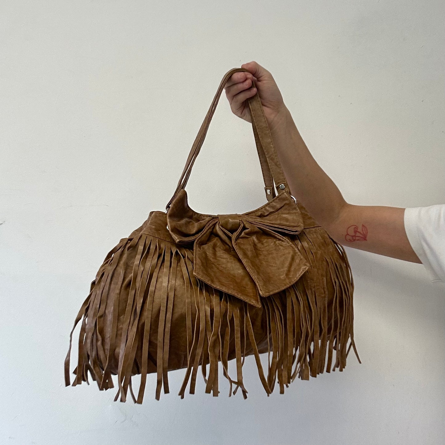 brown fringe oversized bow faux leather shoulder bag