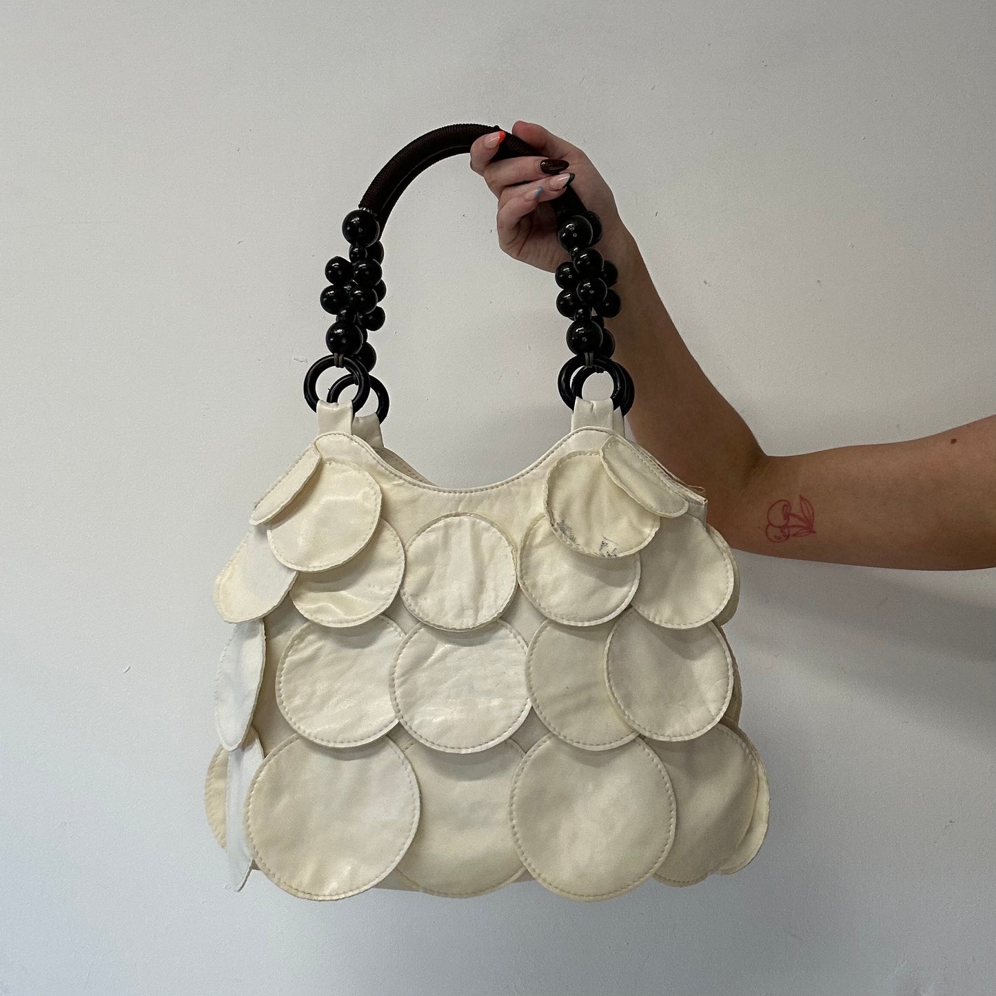 white faux leather disc beaded shoulder bag