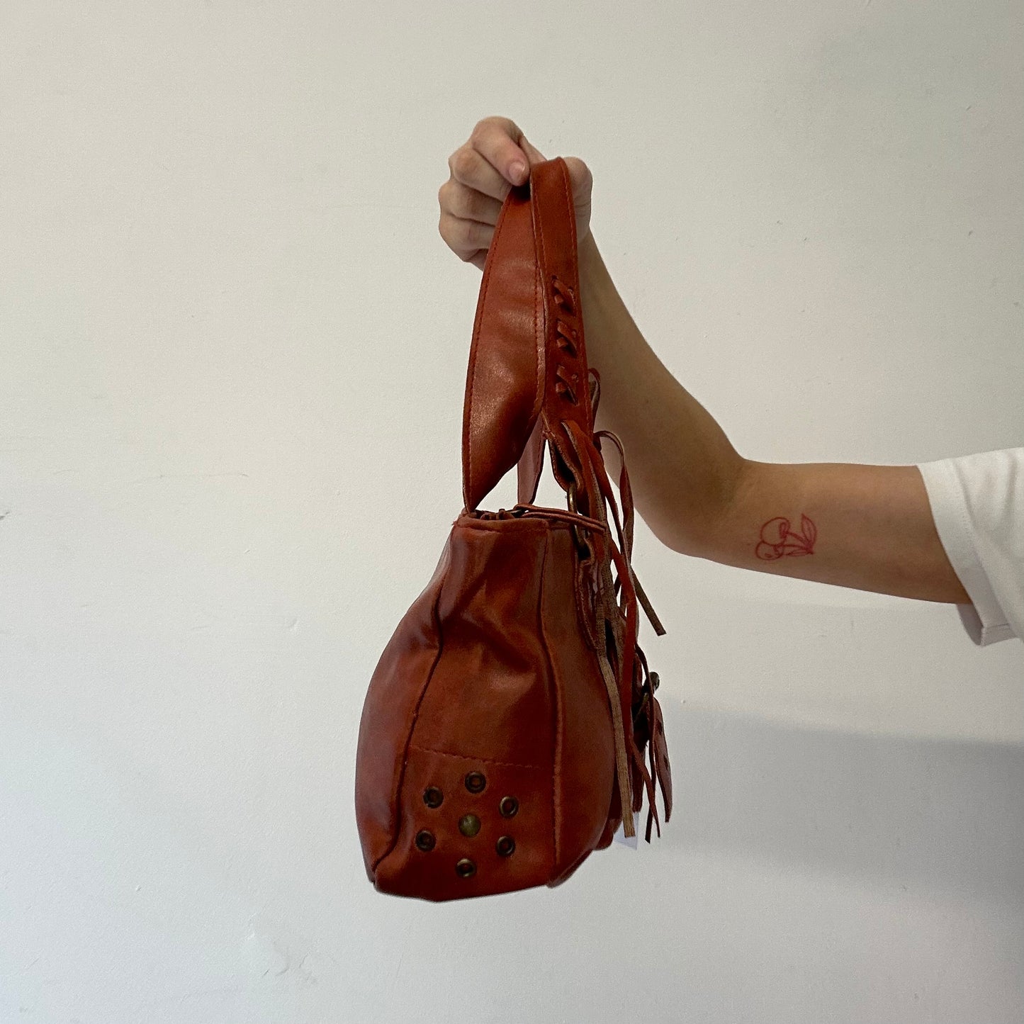 burnt orange / brown leather buckle shoulder bag