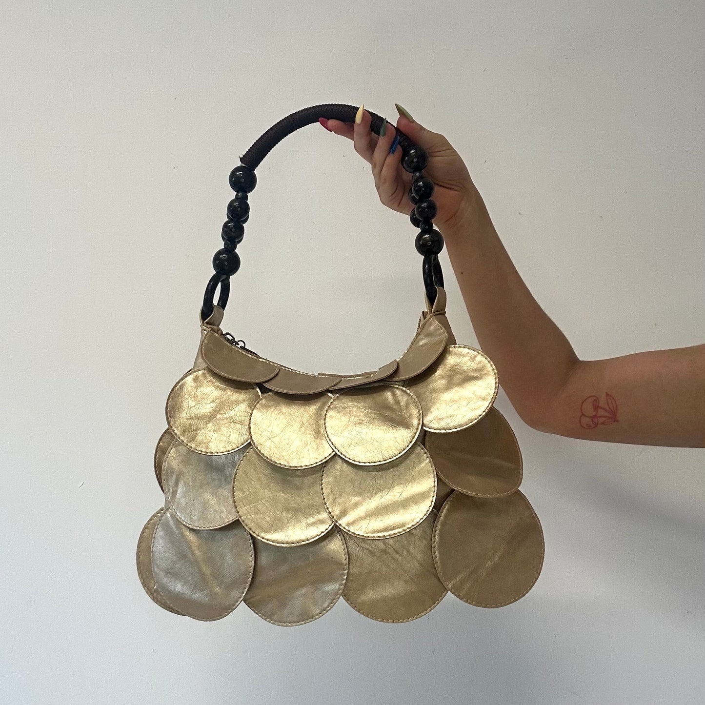 gold faux leather disc beaded shoulder bag