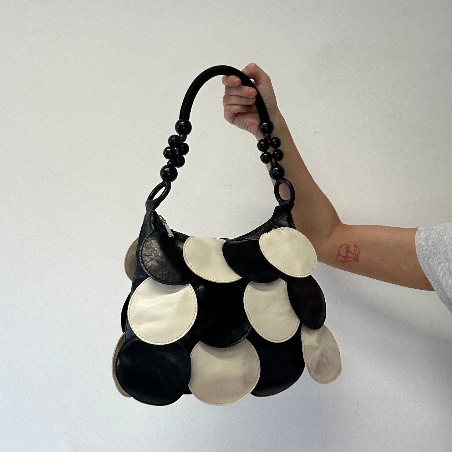 black and white faux leather disc beaded shoulder bag