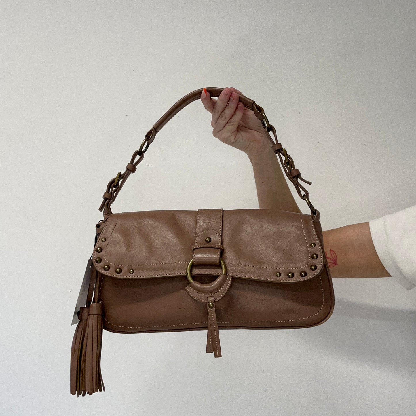 tanned brown studded buckle faux leather shoulder bag