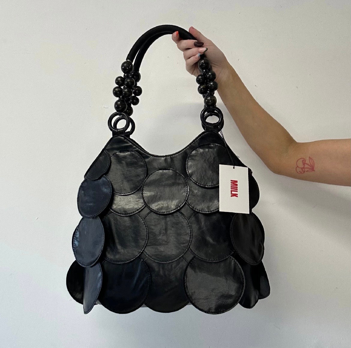 black faux leather disc beaded shoulder bag