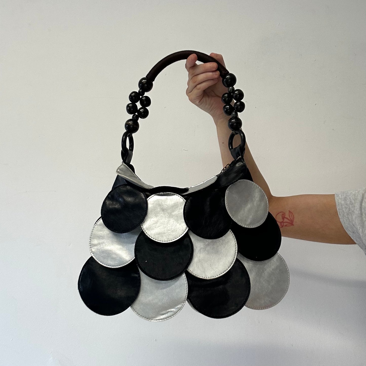 black and silver faux leather disc beaded shoulder bag very