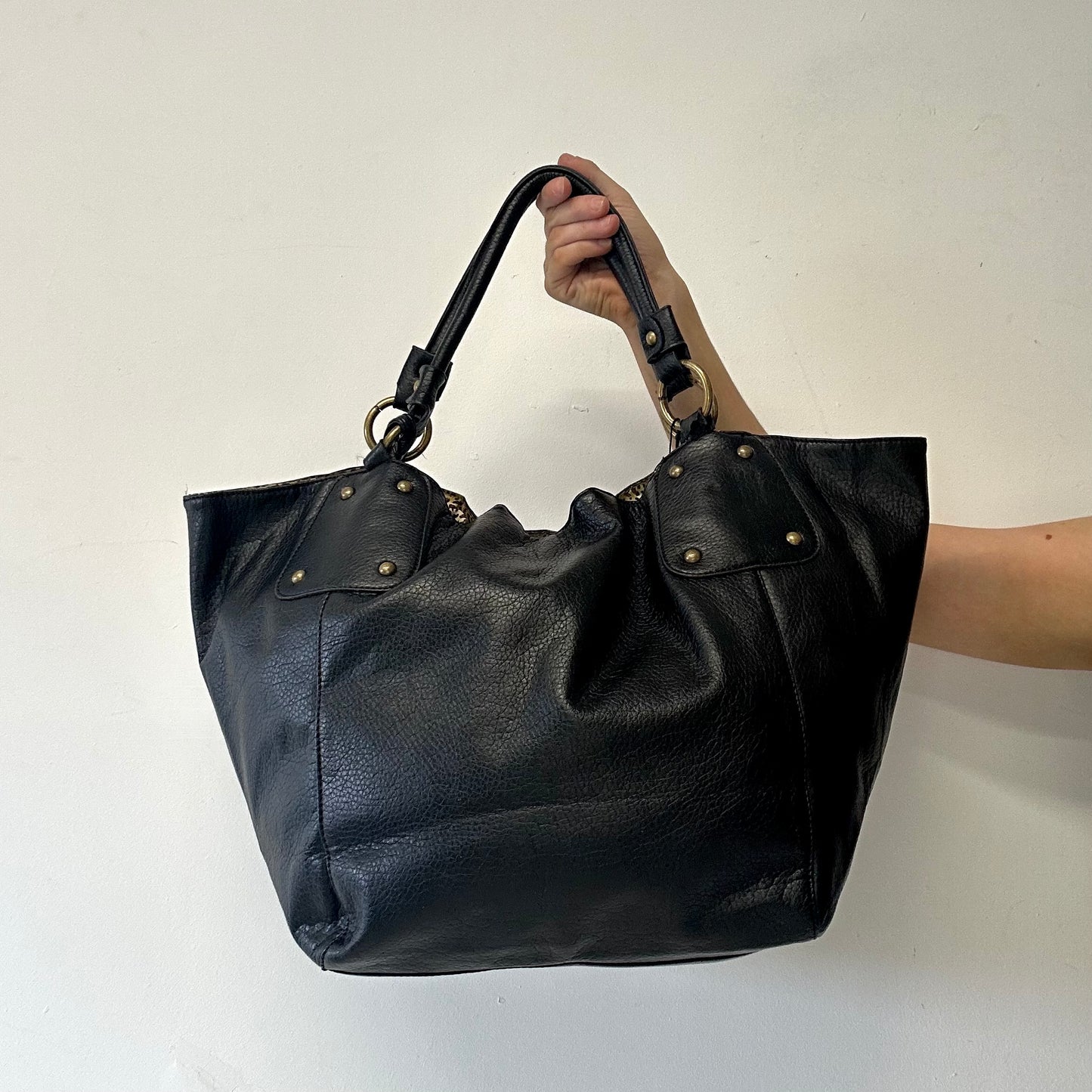 black faux leather single zip shoulder bag