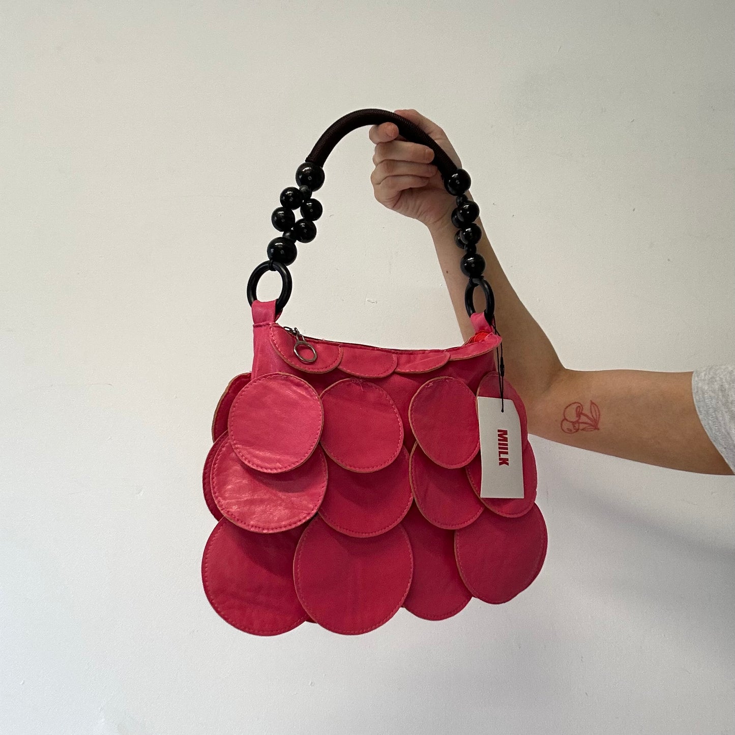 pink faux leather disc beaded shoulder bag