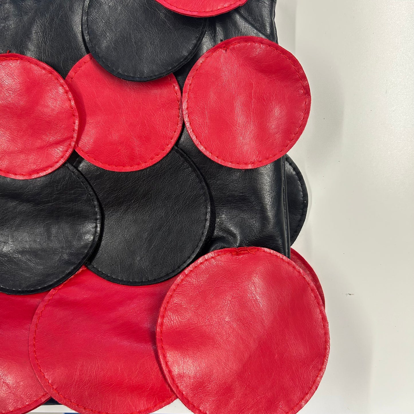 black and red faux leather disc beaded shoulder bag