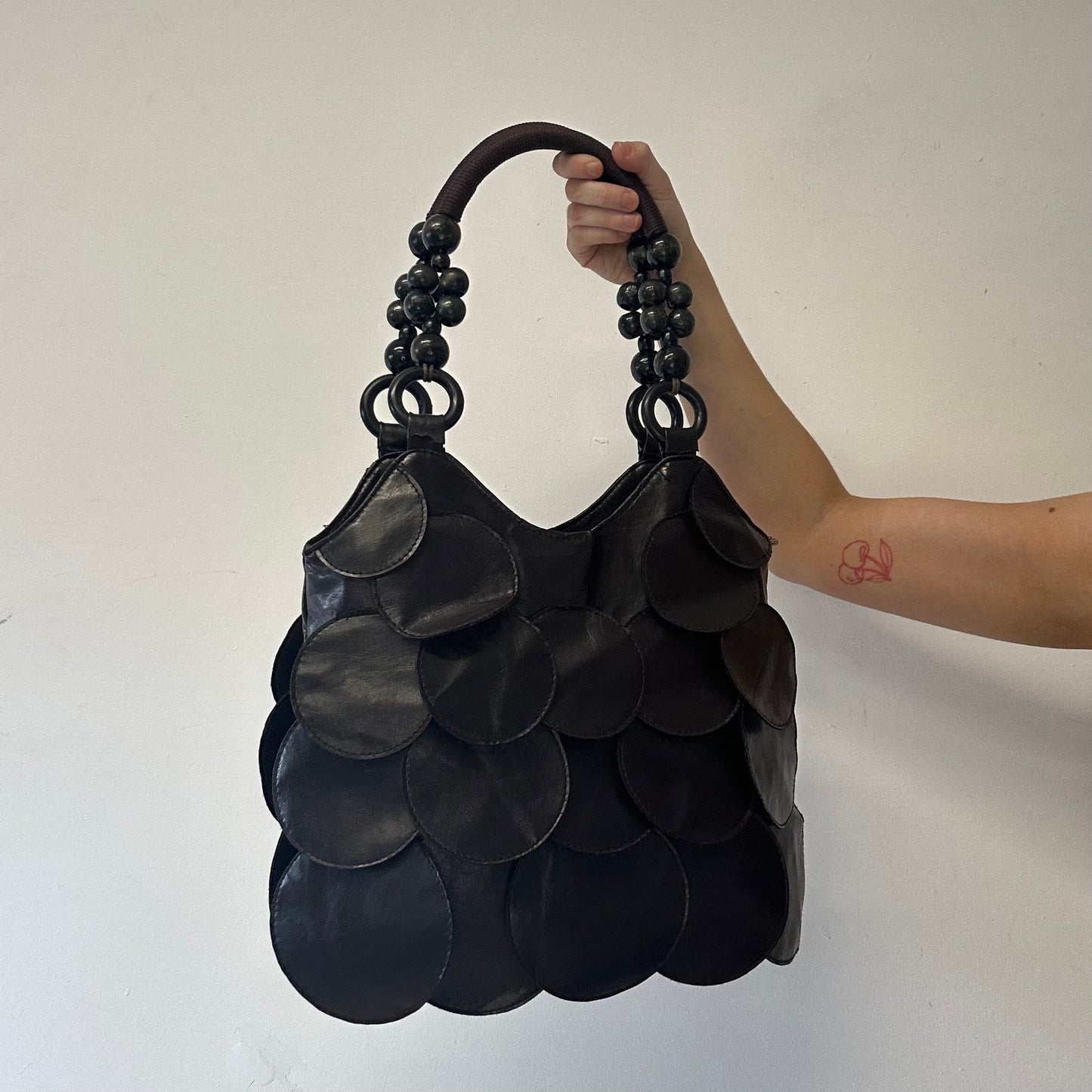 dark brown faux leather disc beaded shoulder bag