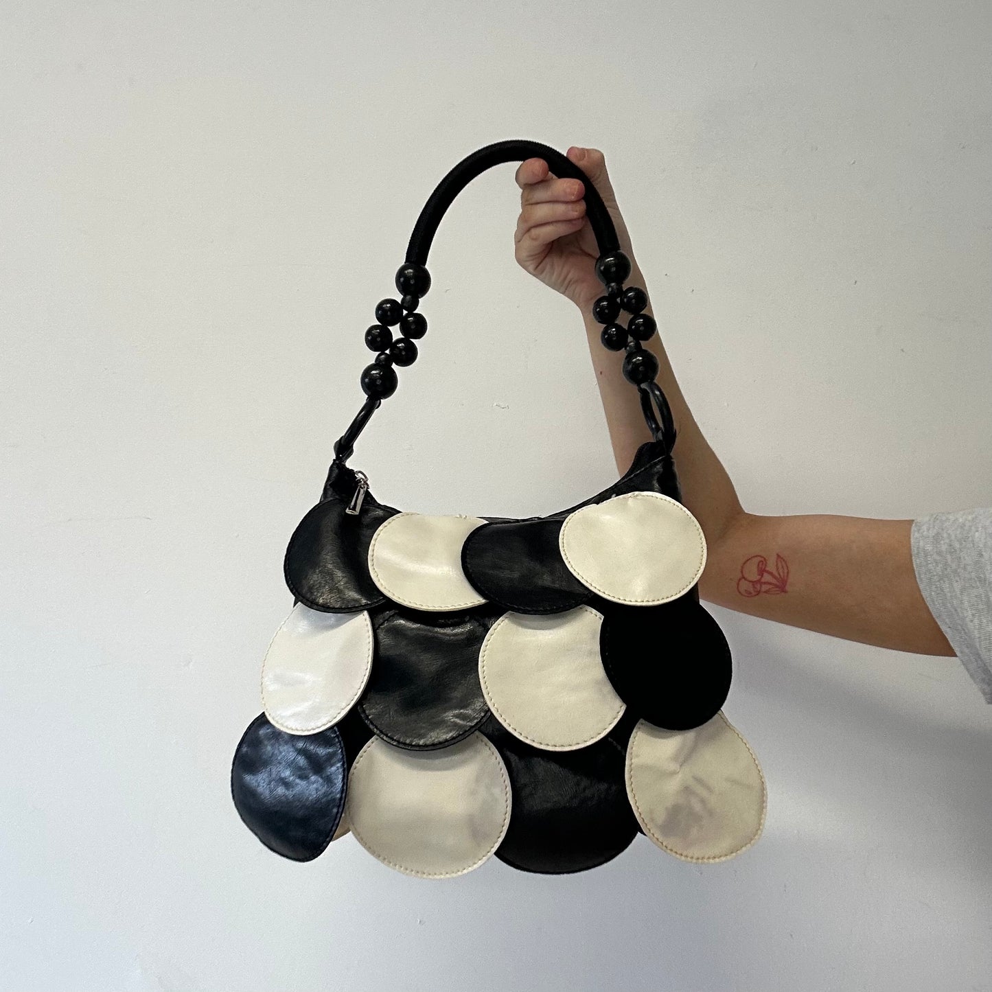 black and white faux leather disc beaded shoulder bag