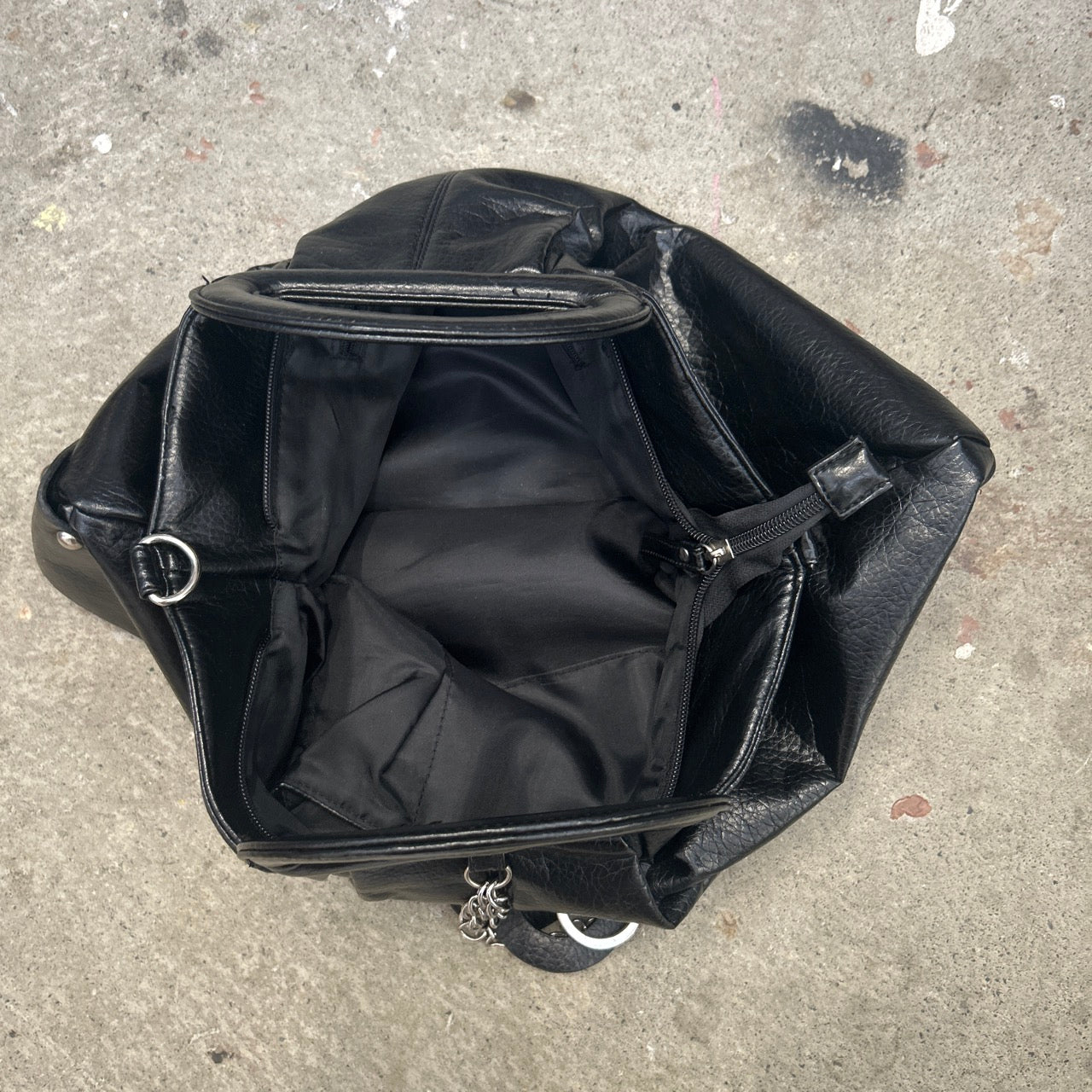black faux leather keychain hand bag