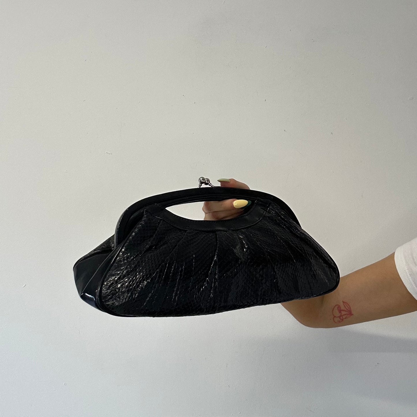 black faux leather croc effect clutch bag