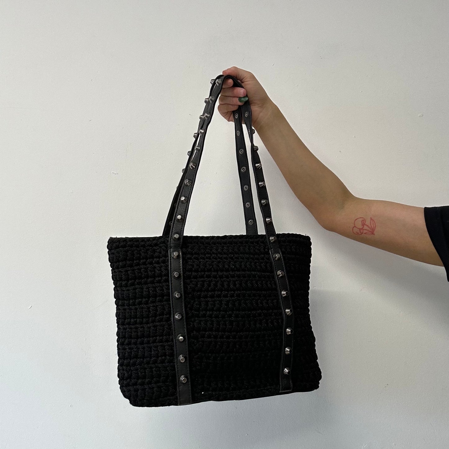 black woven studded shoulder bag