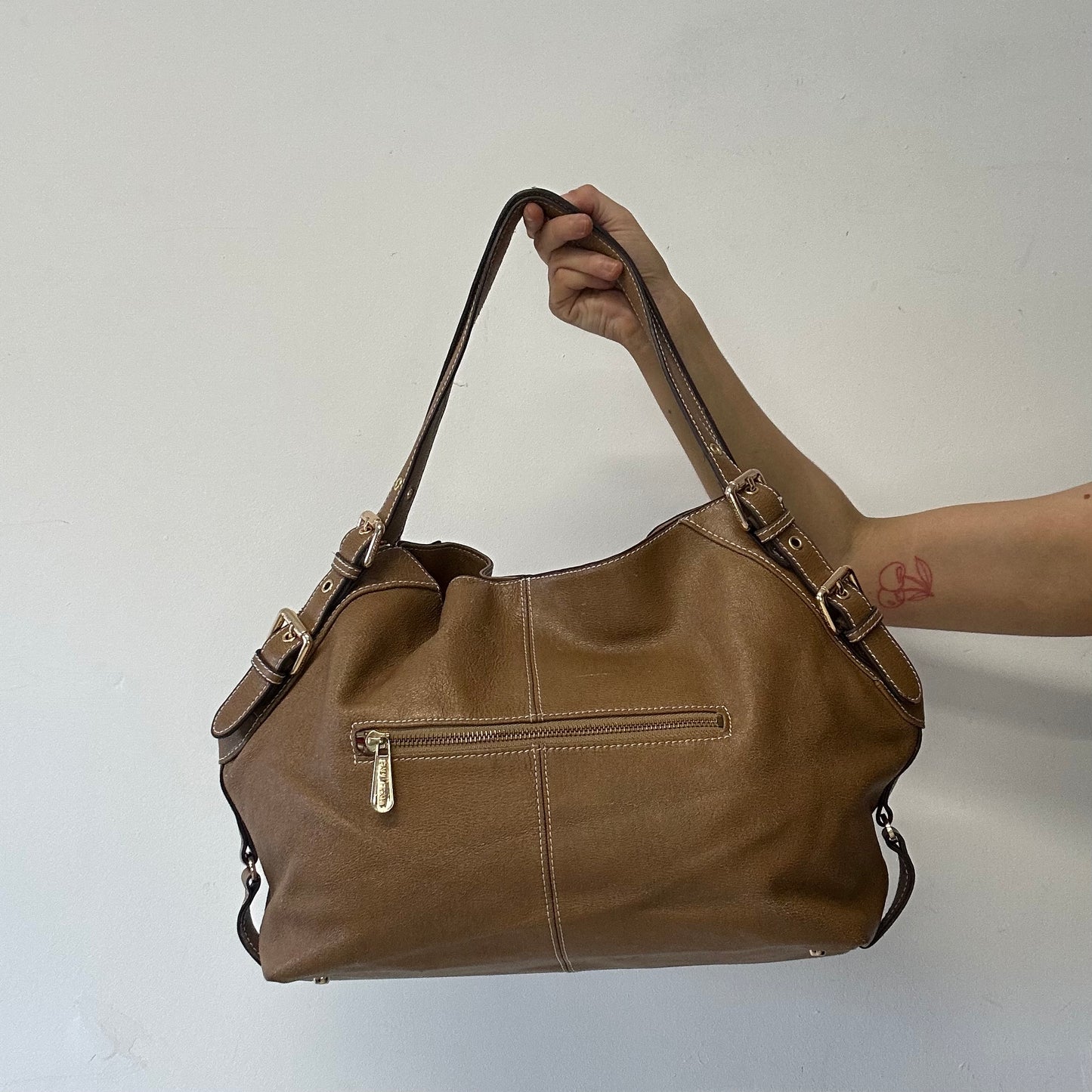brown eyelet faux leather shoulder bag