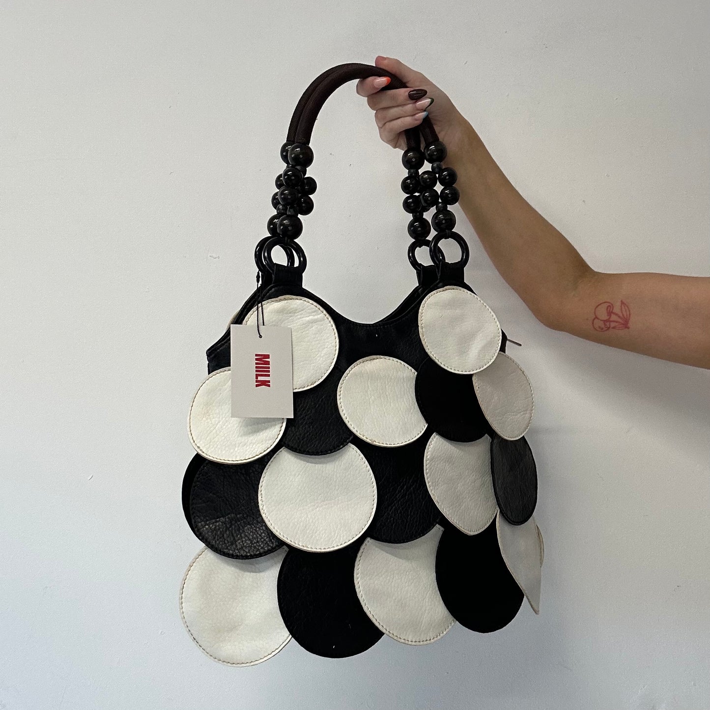 black and white faux leather disc beaded shoulder bag