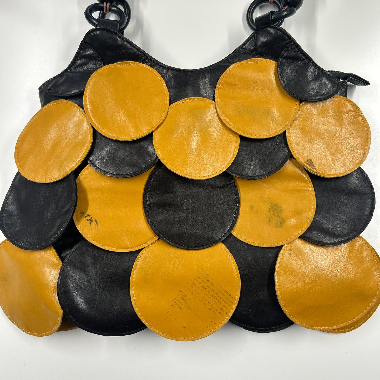 yellow and black faux leather disc beaded shoulder bag