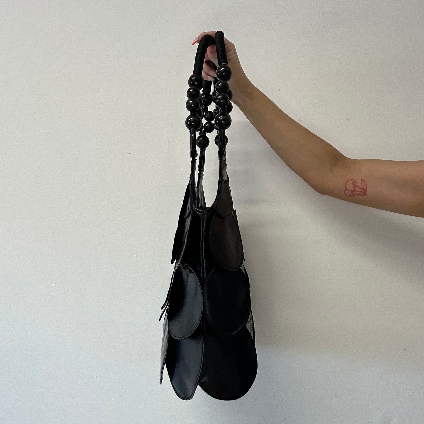 black faux leather disc beaded shoulder bag
