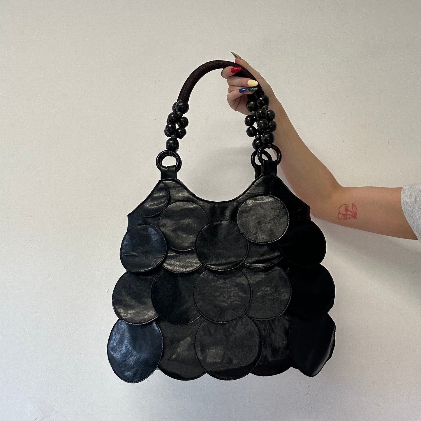 black faux leather disc beaded shoulder bag