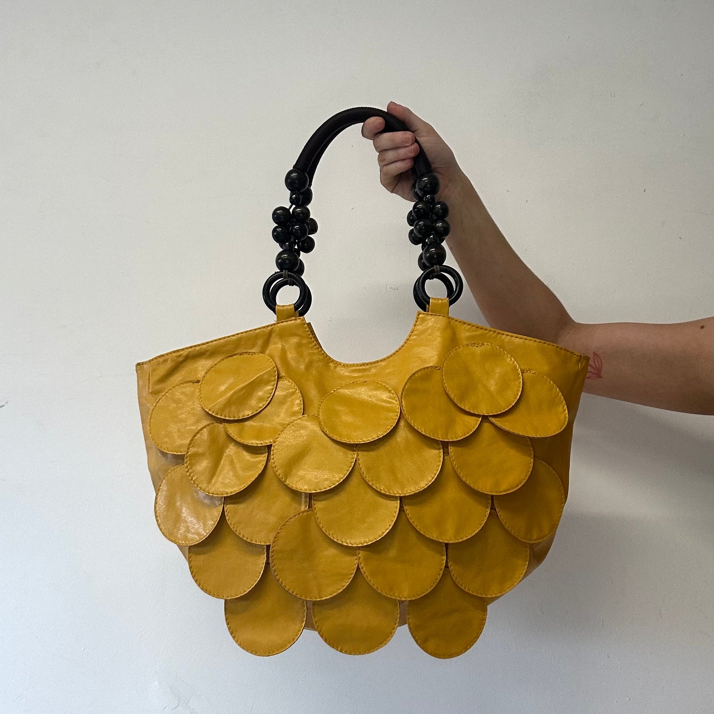 yellow faux leather disc beaded shoulder bag