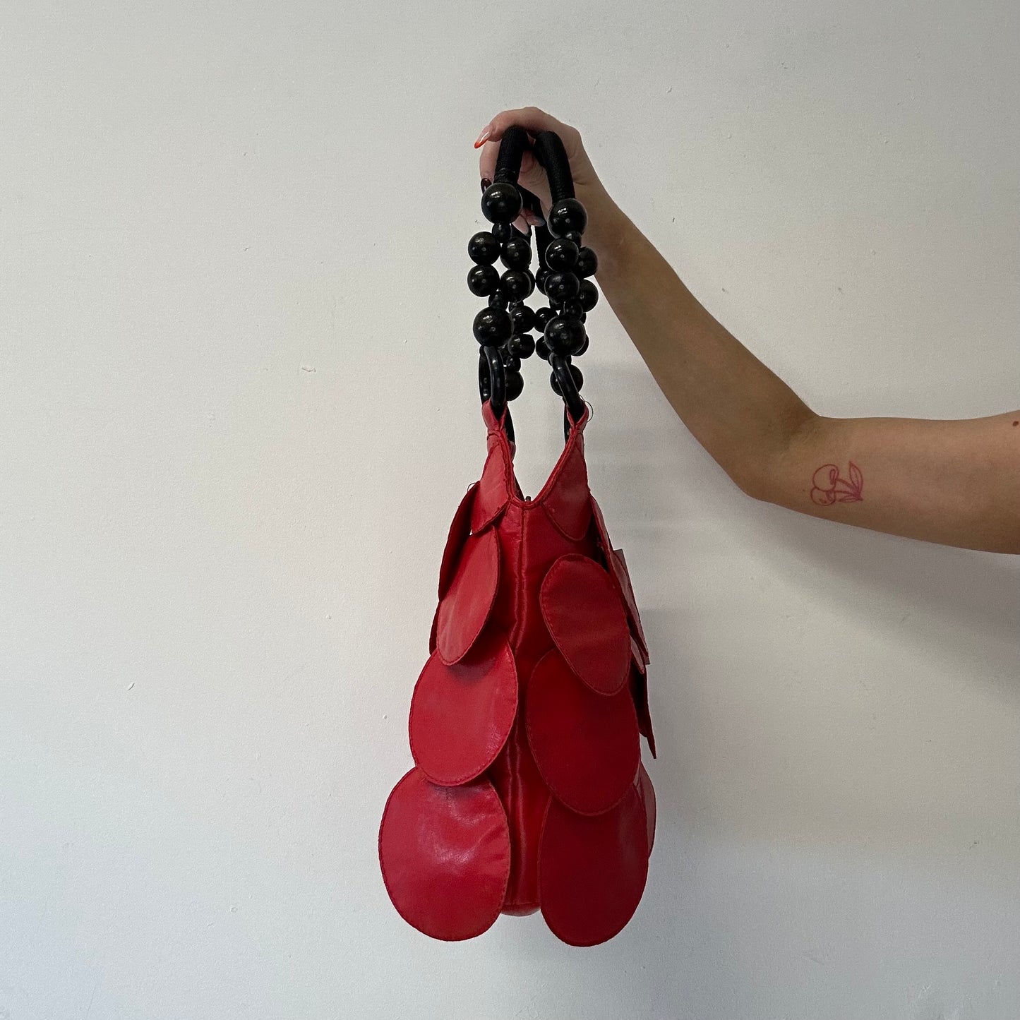 red faux leather disc beaded shoulder bag