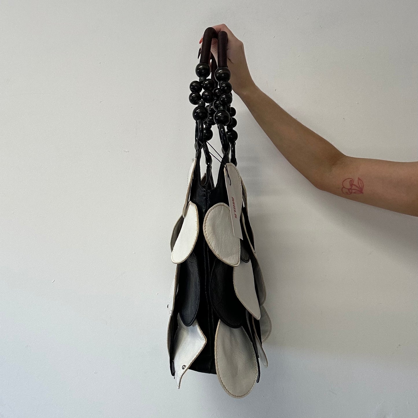 black and white faux leather disc beaded shoulder bag
