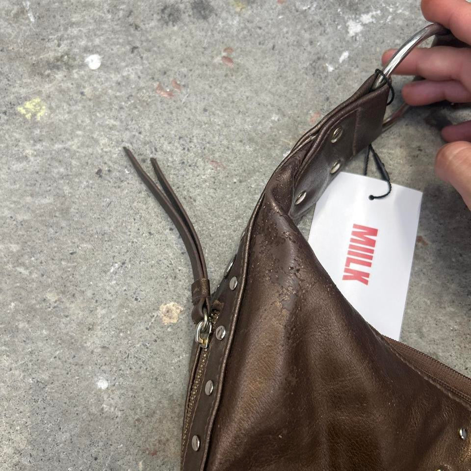brown studded crescent faux leather shoulder bag