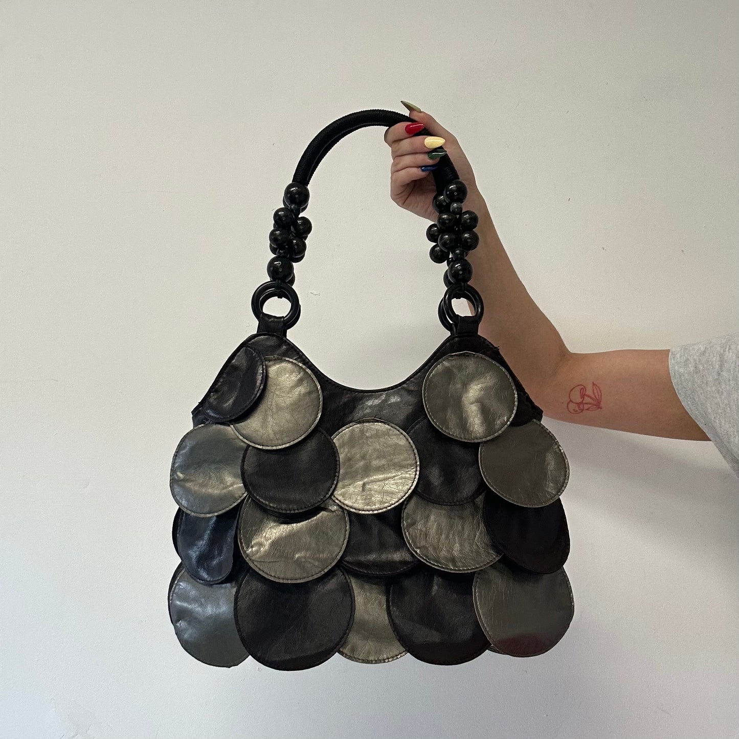 silver and black faux leather disc beaded shoulder bag