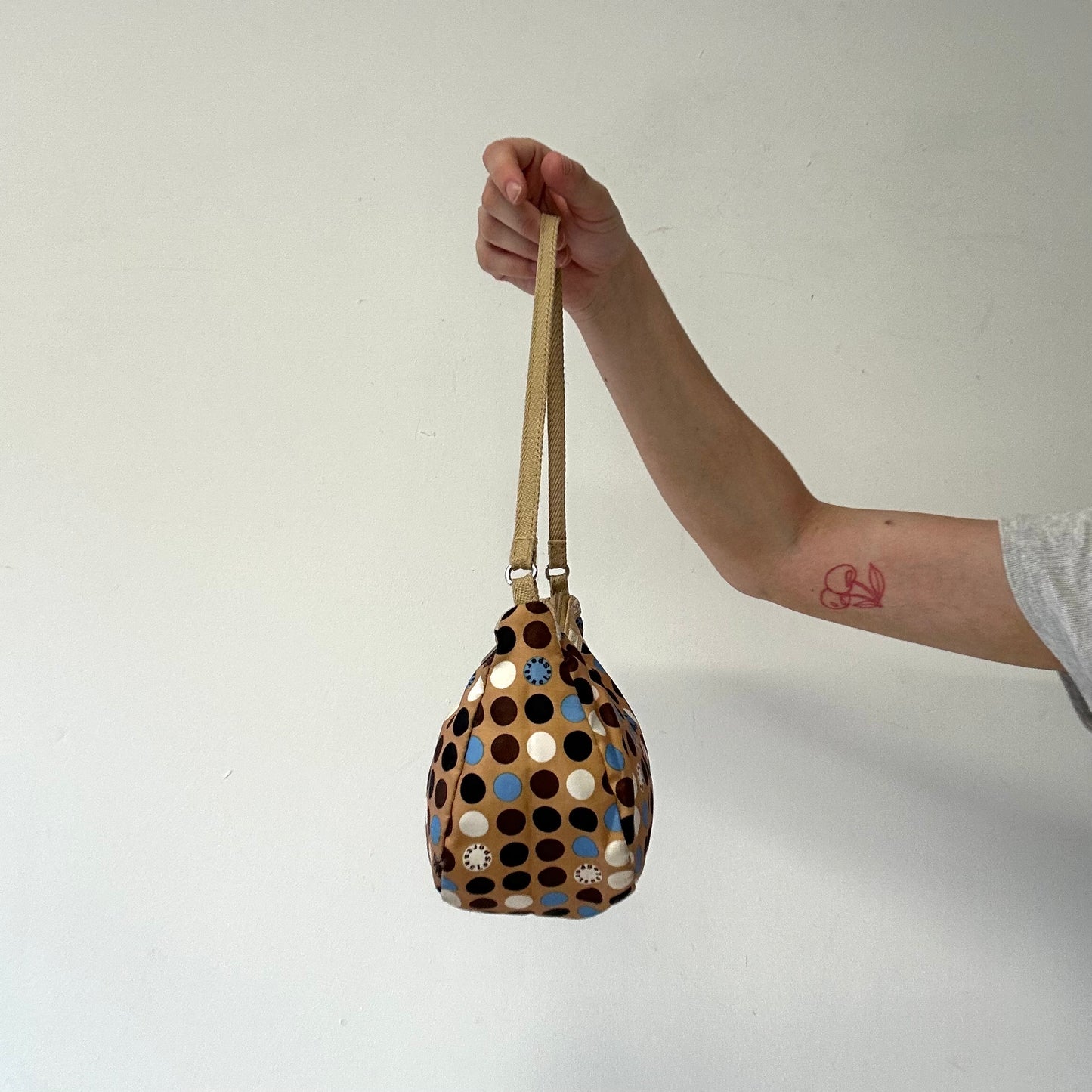 tanned blue polka dot canvas mini shoulder bag