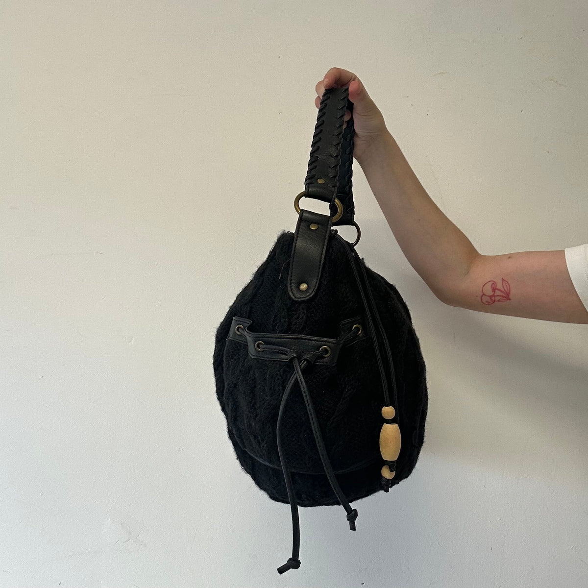 black knitted slouchy shoulder bag