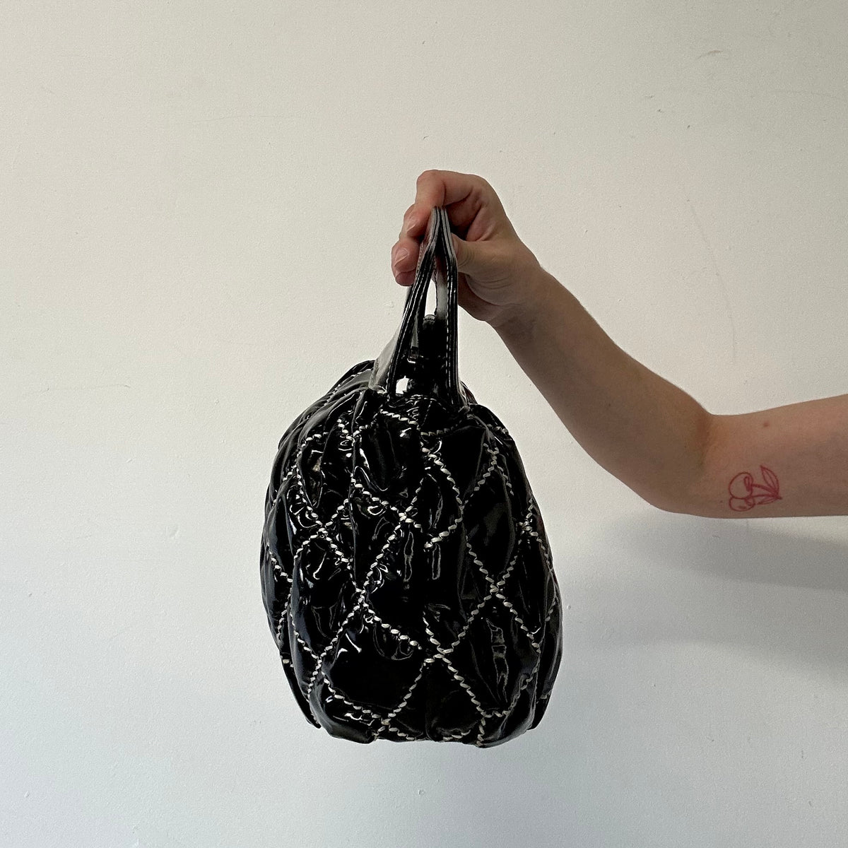 black and white contrast stitching padded handbag