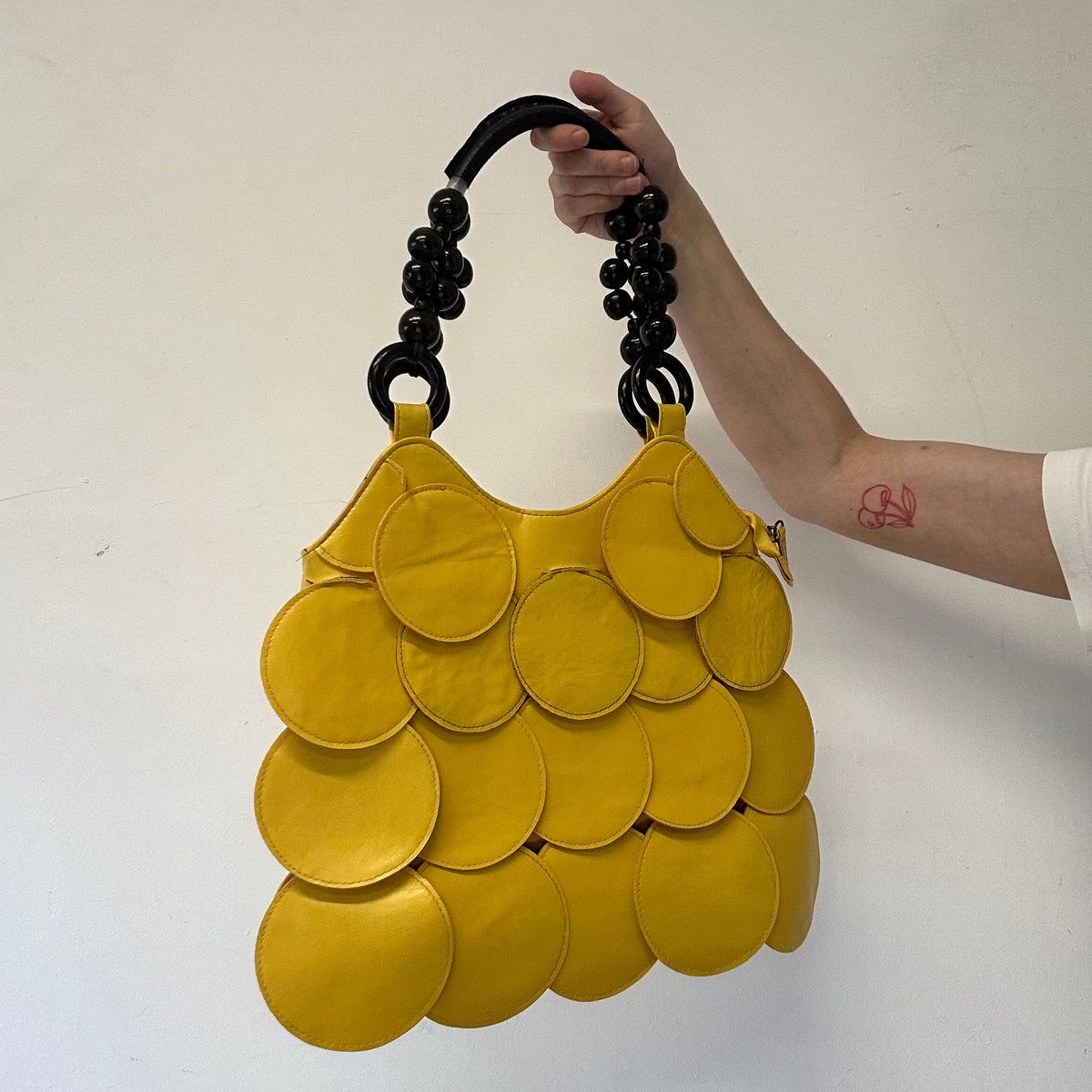 yellow faux leather disc beaded shoulder bag