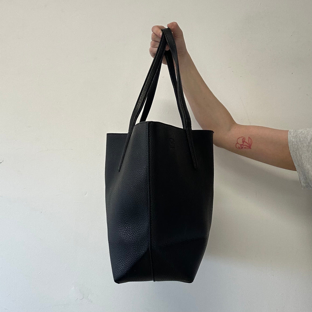 black Calvin Klein faux leather shoulder bag