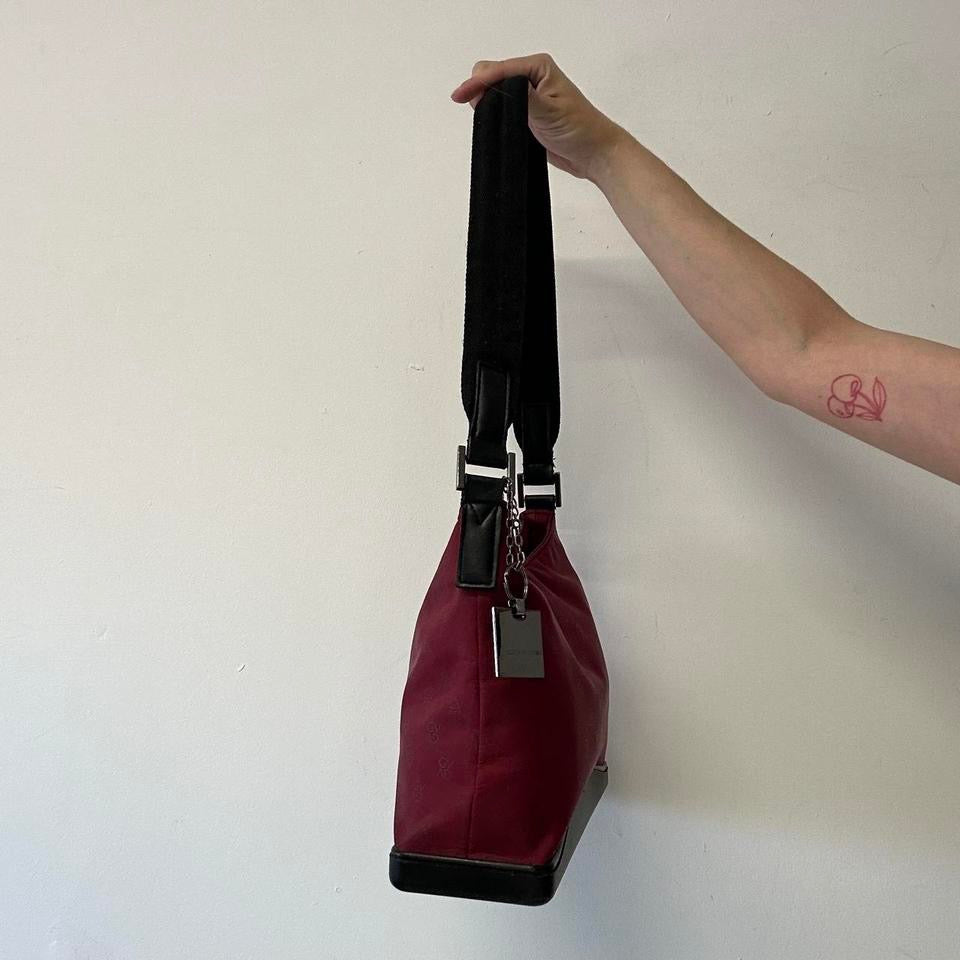 red and black canvas shoulder bag