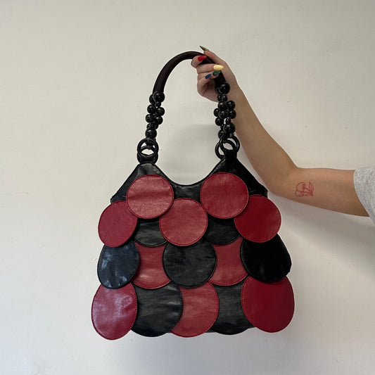 red and black faux leather disc beaded shoulder bag