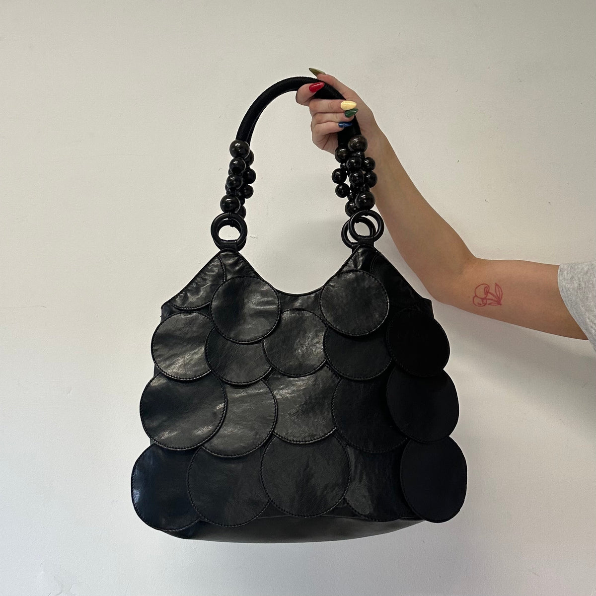 black faux leather disc beaded shoulder bag