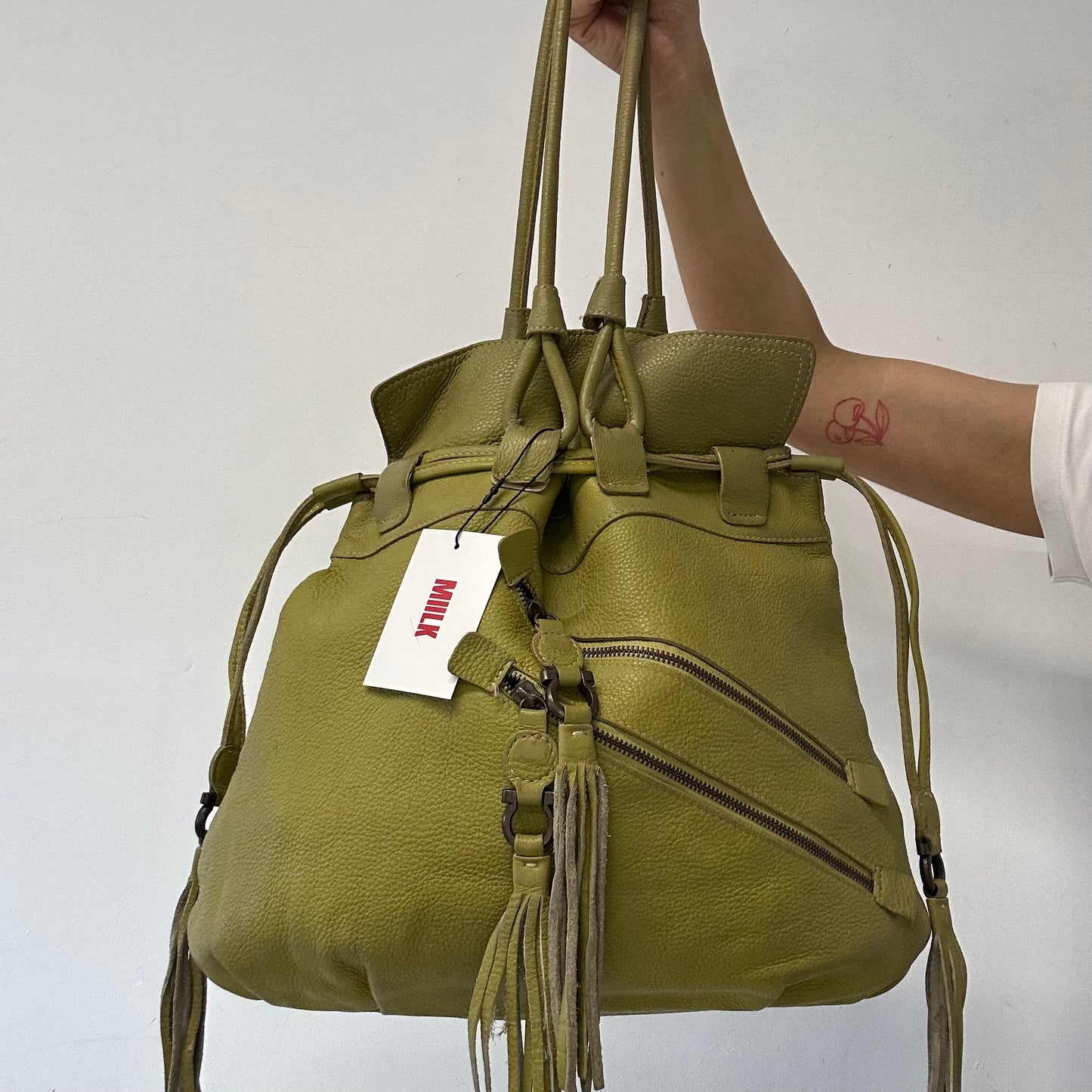 green leather double zip drawstring tote bag