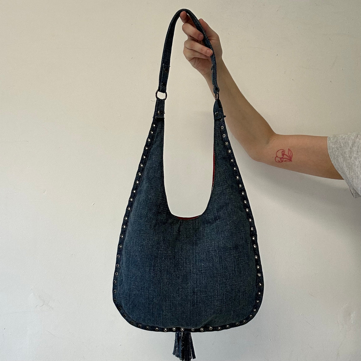 blue denim eyelet shoulder bag