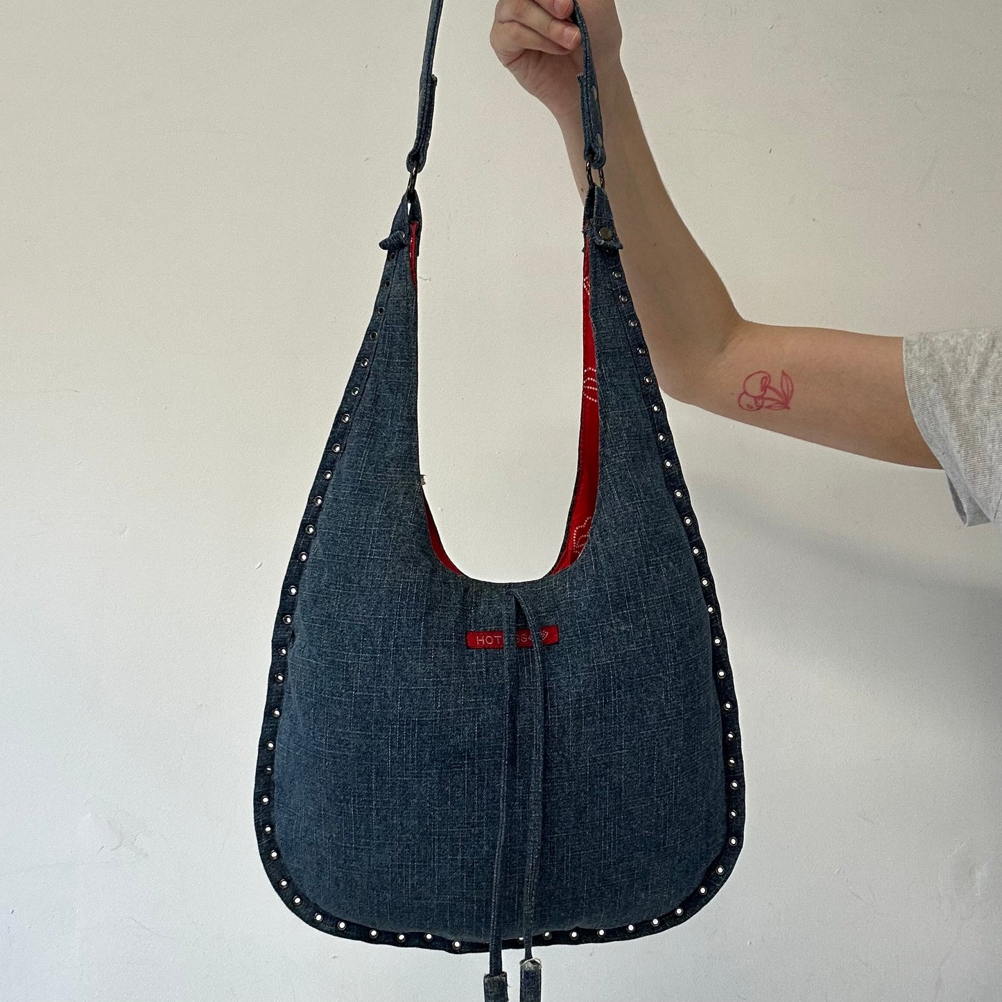 blue denim eyelet shoulder bag