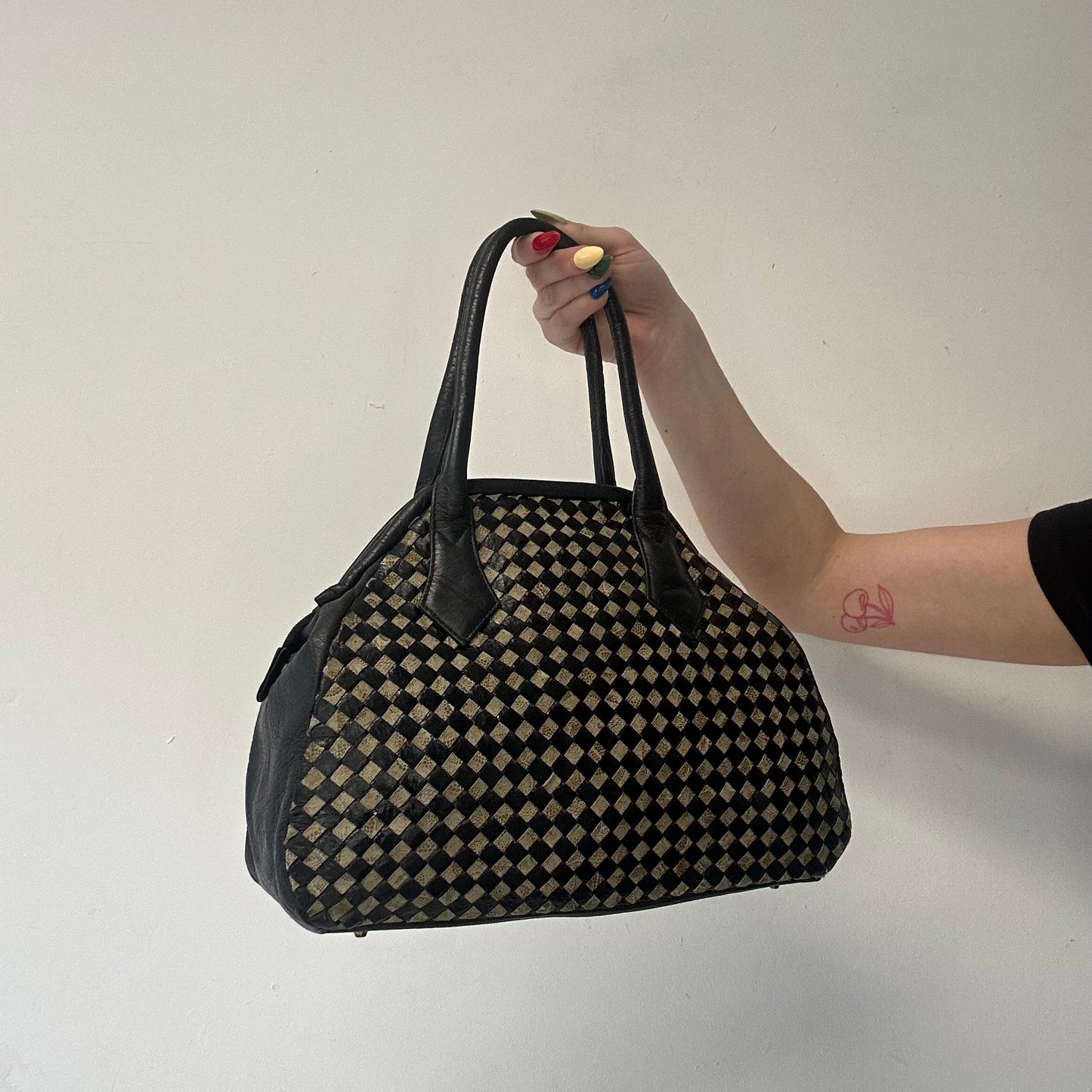 black and tanned woven leather shoulder bag